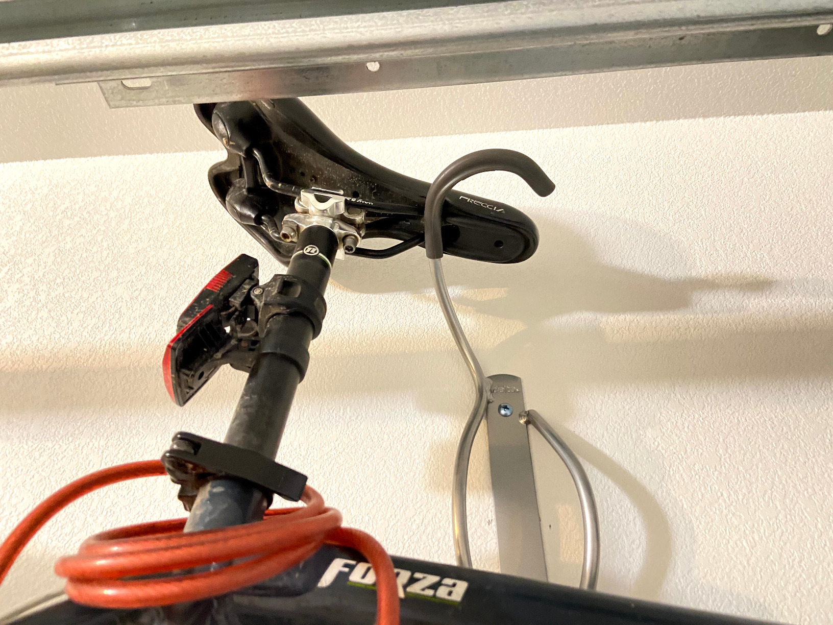 Delta Cycle Leonardo Bike Rack Wall Mount with Tire Tray - Elegant Vertical Hanger Hook Design Provides Easy Bicycle Storage Access - Hassle-Free Installation - Vertical Mount Holds Up to 40 lbs customer photo 1
