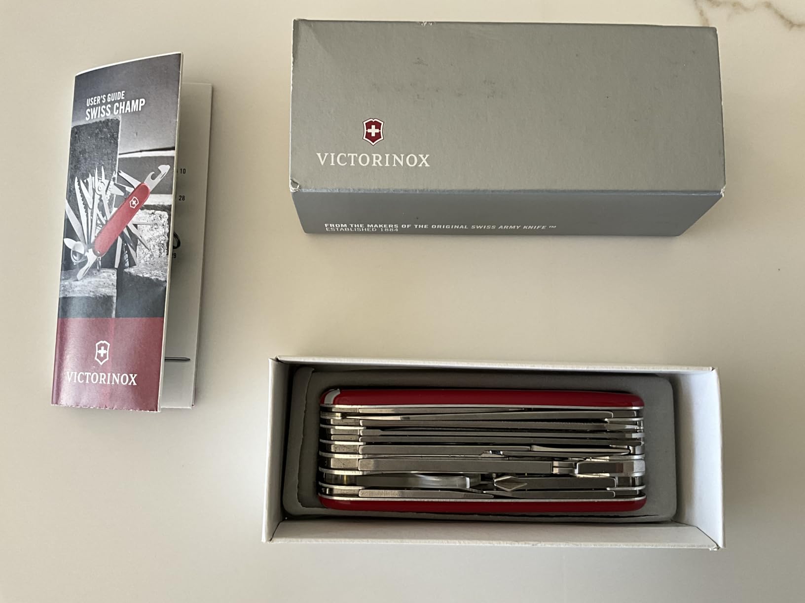 Victorinox Swiss Champ Swiss Army Knife, 33 Functions, Swiss Made Multitool with Large Blade, Screwdriver, Chisel and Combination Pliers for Everyday Carry - Red customer photo 1