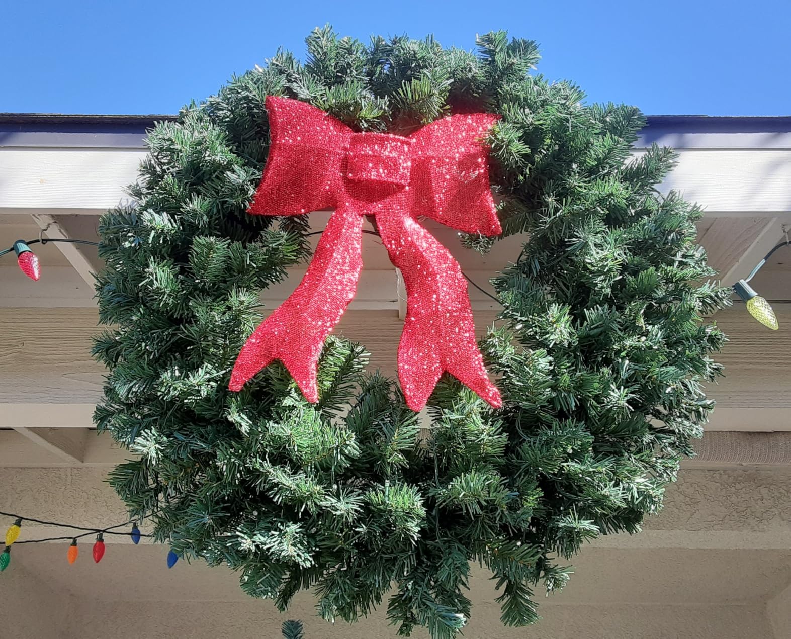 Best Choice Products 24in Large Artificial Pre-Lit Fir Christmas Wreath Holiday Accent Decoration for Door, Mantel w/Red Lighted Bow, 70 LED Lights, 100 PVC Tips, Battery Operated customer photo 1