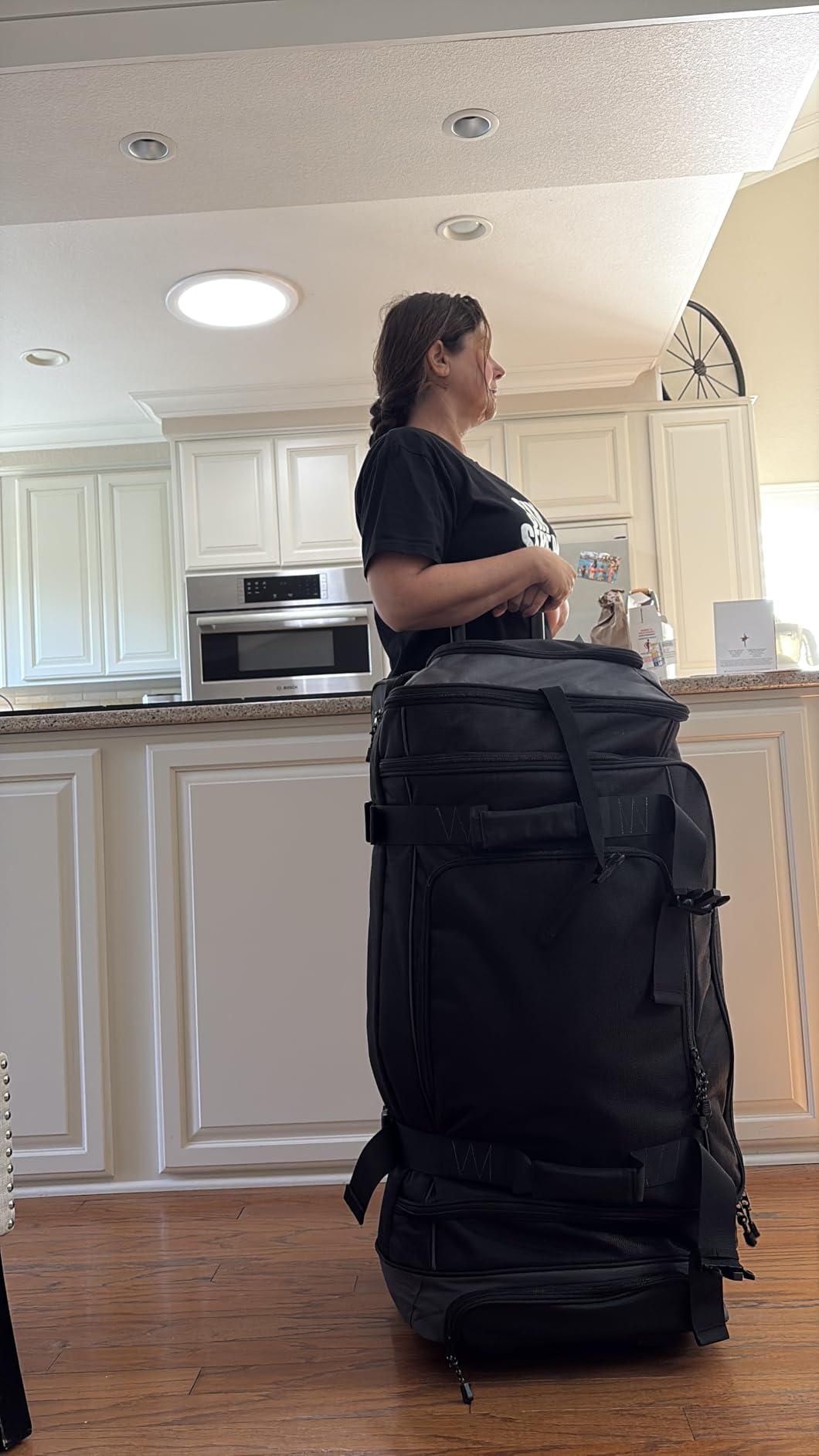 Amazon Basics 35-inch Large Rolling Duffel Bag with Wheels and Handle, Travel Duffle with Durable Ripstop Polyester Material, 2 Layers of Storage Space, Multiple Interior and Exterior Pockets, Black customer photo 1
